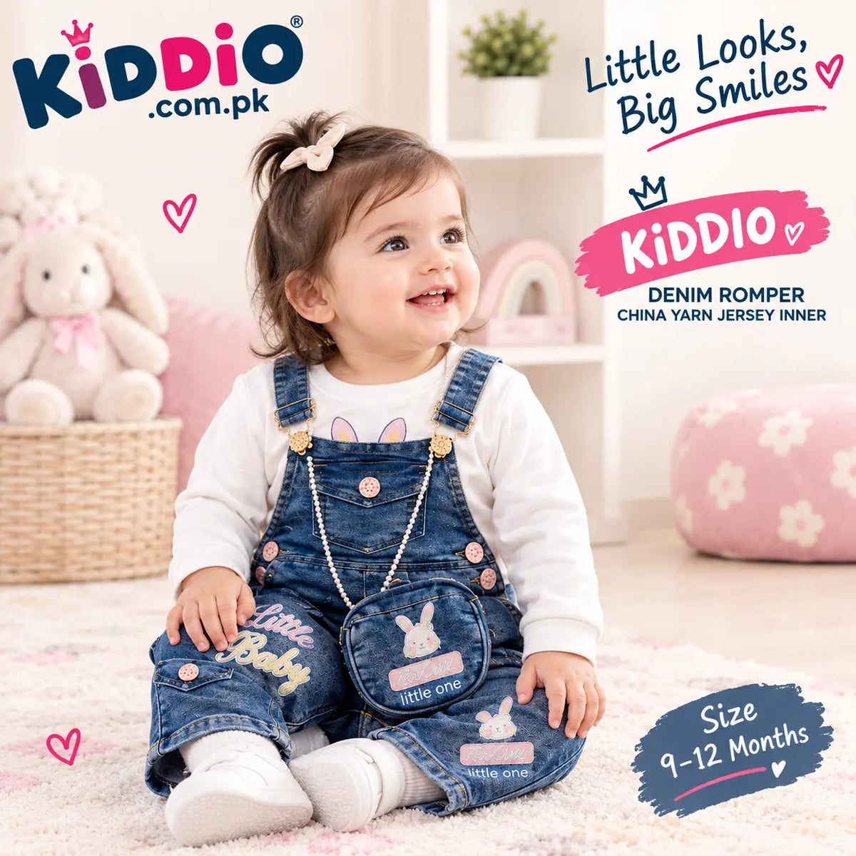 A toddler girl sitting on a white rug wearing a denim romper over a white long-sleeve shirt. The image features promotional text overlays for 'KIDDIO .